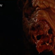The skinless mutant bear attacks in a scene from Prophecy.